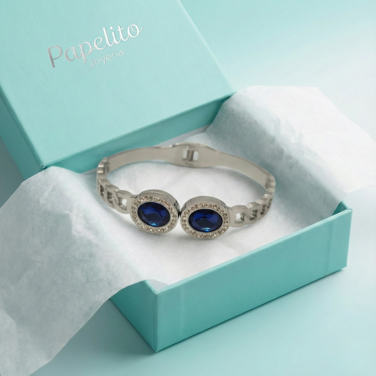 Pulsera Rígida con Dos Cristales Azules Ovalados y Circonitas - 100% Acero Bañado en Rodio