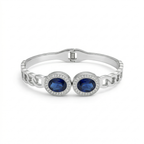Pulsera Rígida con Dos Cristales Azules Ovalados y Circonitas - 100% Acero Bañado en Rodio